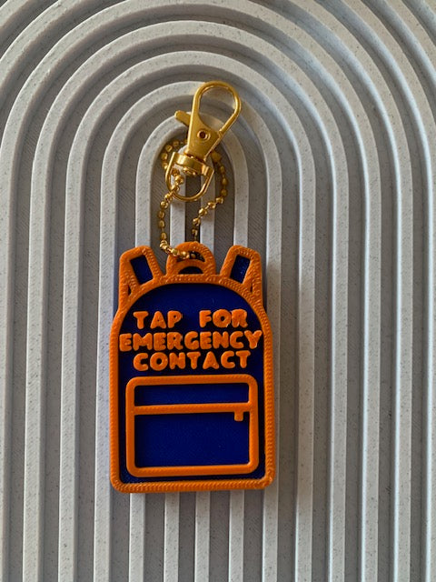 Blue and orange backpack SAFE Tag keychain that says Tap for Emergency Contact