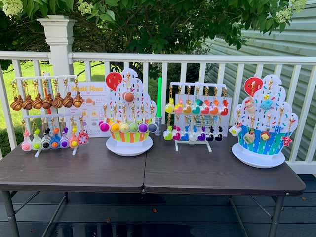 Colorful Etchline 3D party favor and clicker keychain display at a family reunion