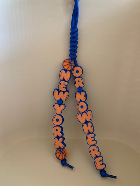 New York Or Nowhere chunky 3D charm keychain with orange and blue bubble lettering, basketball details, 4mm paracord loop, and metal key ring.