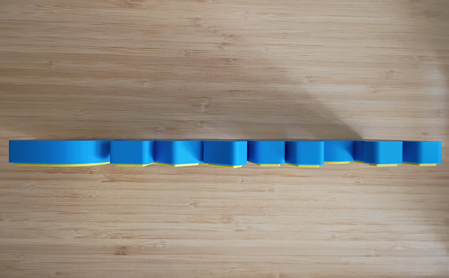 Side profile of Pokémon 3D printed desktop and wall sign showing layered thickness